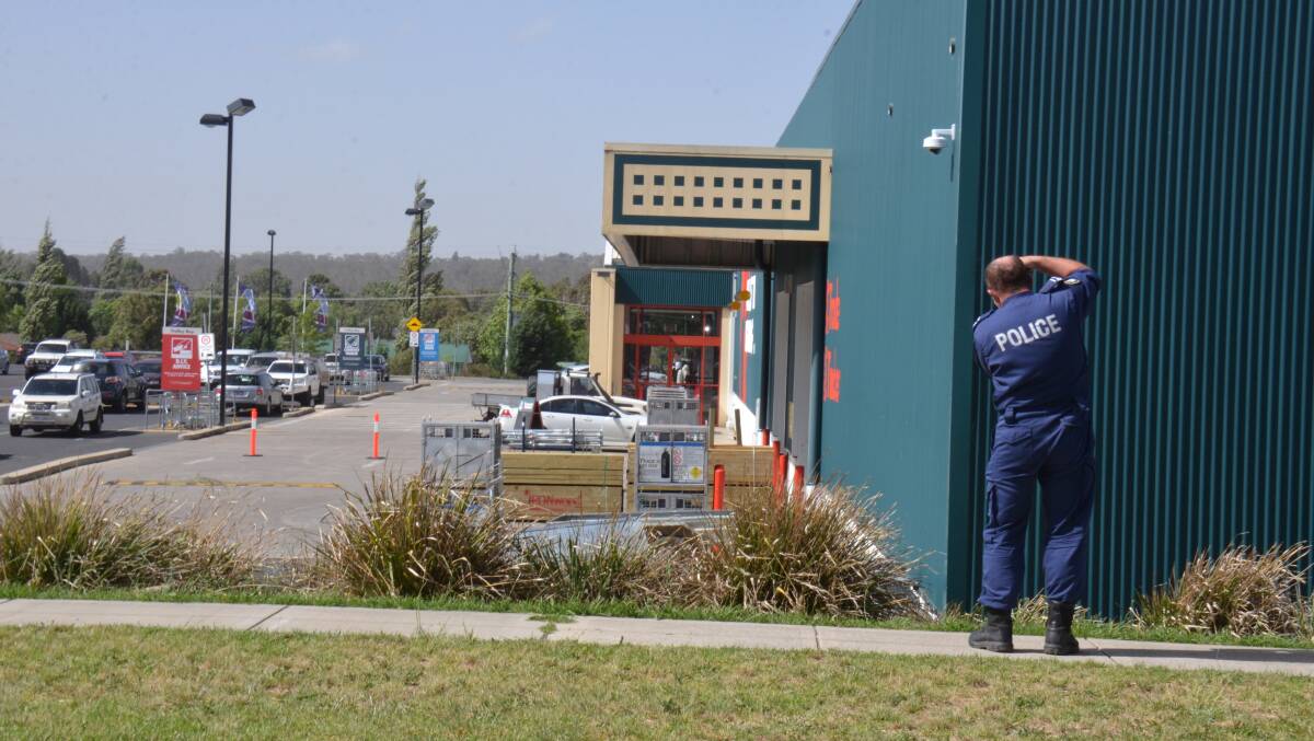 A forensic police officer examines one of two crime scenes setup in Armidale. Photos: Laurie Bullock