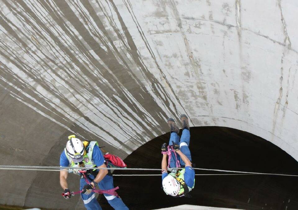 Going down: A bird's eye view of two paramedics as they head down the spillway of Tamworth's water supply. Photo: State Emergency Service