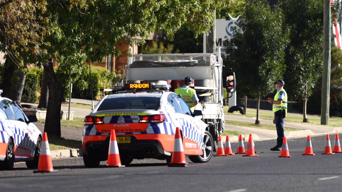 Traffic blitz: Highway patrol officers at the scene of the vehicle stop on Jewry St in Taminda on Friday afternoon. Photo: Gareth Gardner