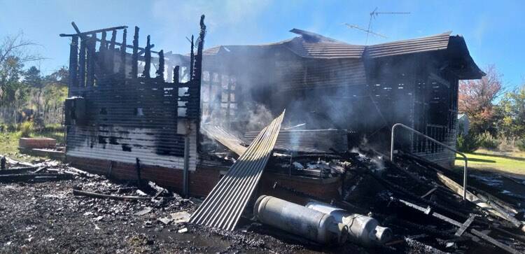 The burnt out shell of the Tingha home where a man was found dead on Monday morning. Photo: Supplied