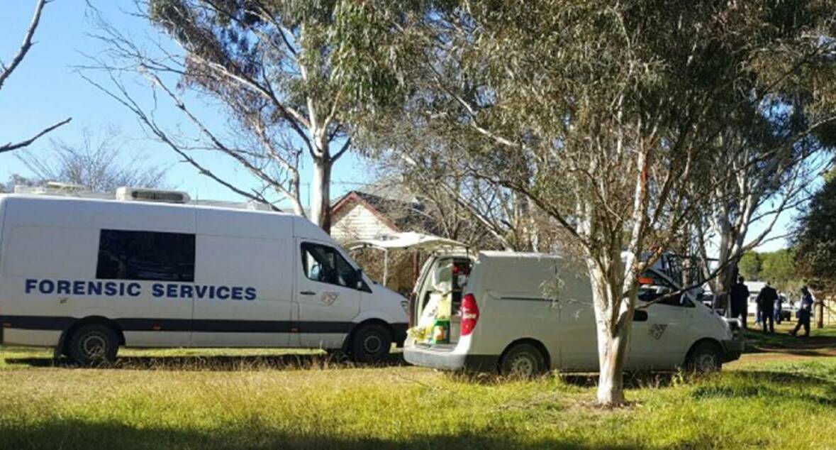 Crime scene: Forensic police and detectives at the property at Dangarsleigh near Armidale in June after Mr Hodge's body was discovered.