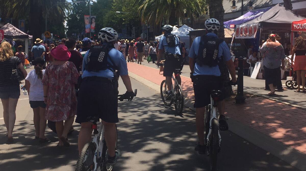 On patrol: Police on bikes during the country music festival in Tamworth in 2018.