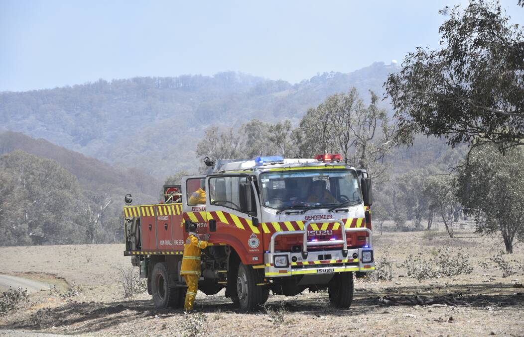 Relentless fight: RFS firefighters have been attacking the suspicious Moonbi fire for 10 days straight, but it was still out of control on Friday night. Photo: Jacob McArthur