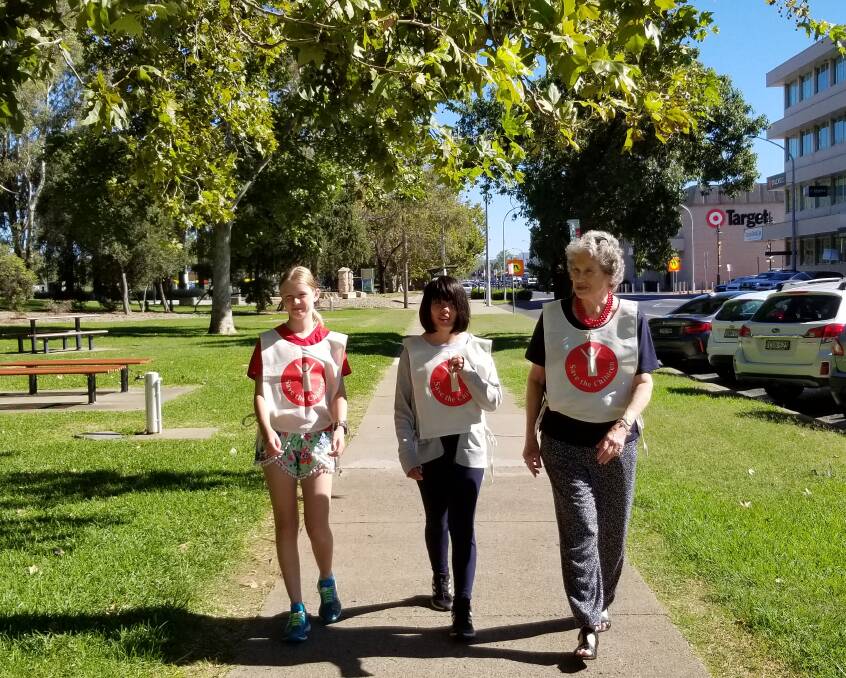 Riverside walk: Save the Children committee member Judith Archbold, with youngest fundraiser Ruby Miller and Louisa Link.