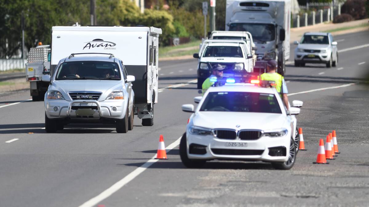 On patrol: Highway officers stop cars on the New England Highway in Tamworth as part of the Easter roads blitz. Photo: Gareth Gardner 160419GGB06