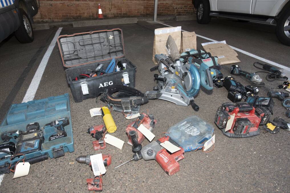 Goods seized: Some of the power tools uncovered in the police raid which police suspect were stolen during a break-in at a job site off Goonoo Goonoo Road in Tamworth overnight on Monday. Photo: Peter Hardin