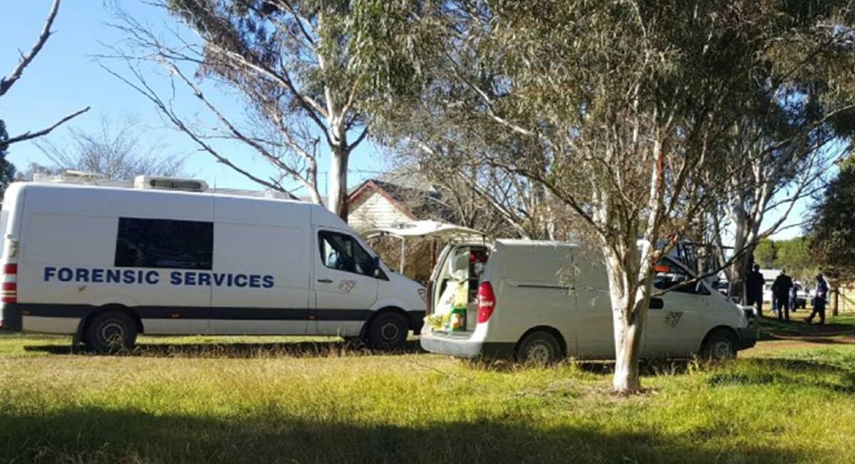 Crime scene: Forensic police and detectives at the property at Dangarsleigh near Armidale on Thursday morning where a 43-year-old man's body was discovered.