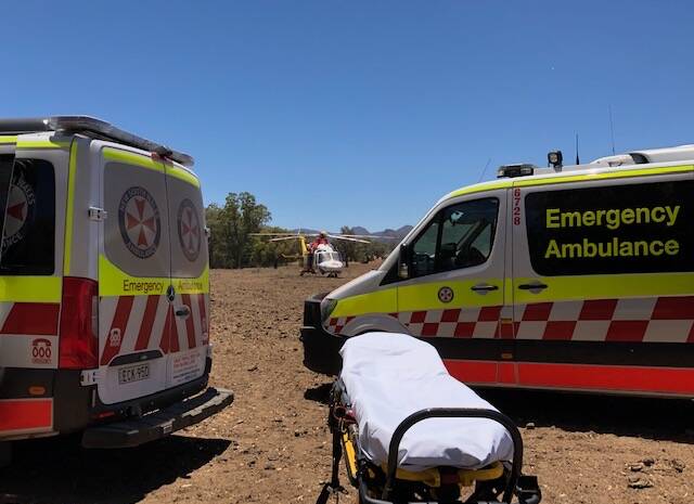 Mission: The Westpac Rescue Helicopter and paramedics on scene in Tooraweenah on Monday. Photo: Westpac Rescue Helicopter