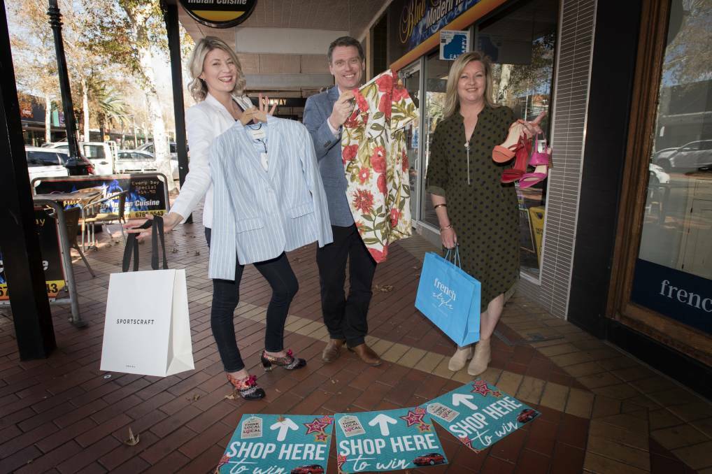 Shop local:: Shonnah Smith, major sponsor Centrepoint's manager Martin Howes and Regina French. Photo: Peter Hardin 040919PHG008
