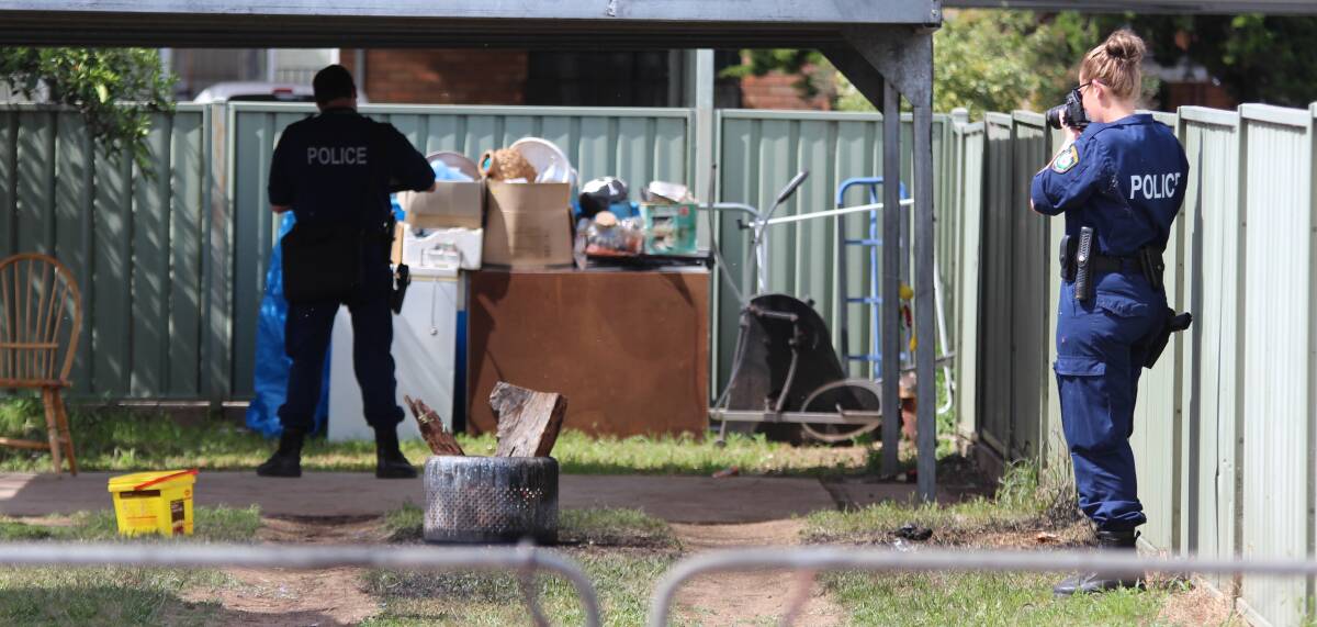 Crime scene: Specialist forensic police examine the backyard where the explosion occurred. Photo: Sam Woods