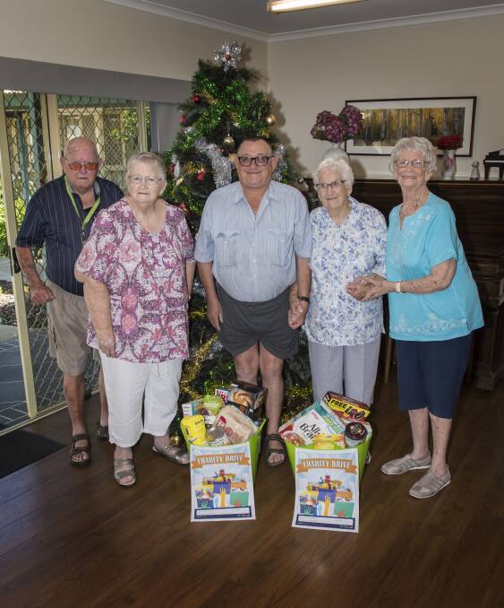Time for giving: Ingenia Gardens Retirement Village residents Roy Holt, Lynne Weekes, Ken Russell, Shirley Christine and Elaine Nott. Photo: Peter Hardin 211218PHC006
