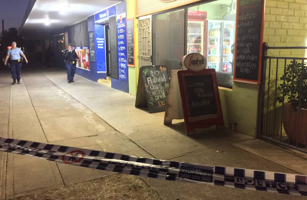 Crime scene: Police cordoned off the Hillvue Superette and the neighbouring cafe on Hillvue Road, Tamworth after the robbery on May 21. Photo: Gareth Gardner