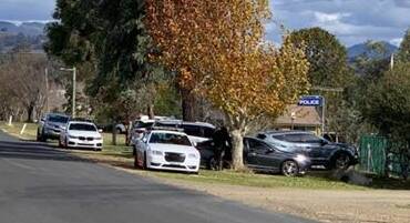 Major manhunt: Dozens of police were in Nundle near Tamworth on Wednesday afternoon as part of a search for a suspect. Photo: Fabian Norrie