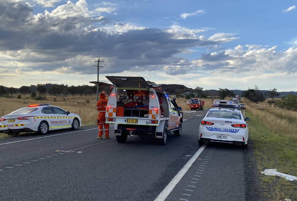 Police, SES and fire crews at the scene of the crash on the New England Highway on Wednesday night. Picture supplied by NSW SES Armidale Unit