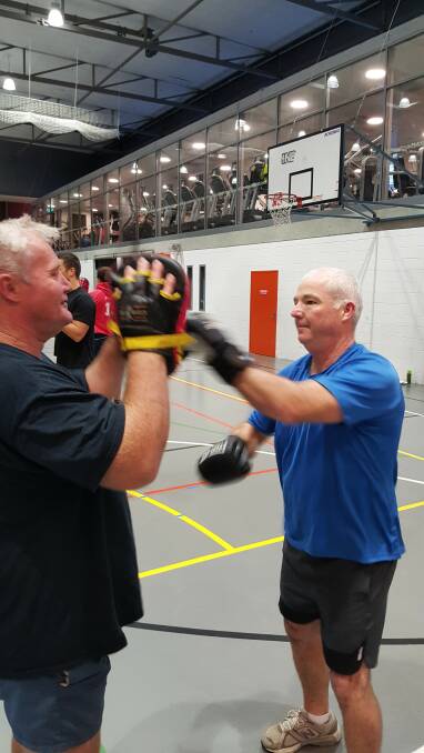 Punching on: New England Senior Constable Chris Borger is shown the ropes during a tour of the Redfern program, Clean Slate Without Prejudice, in Sydney. 