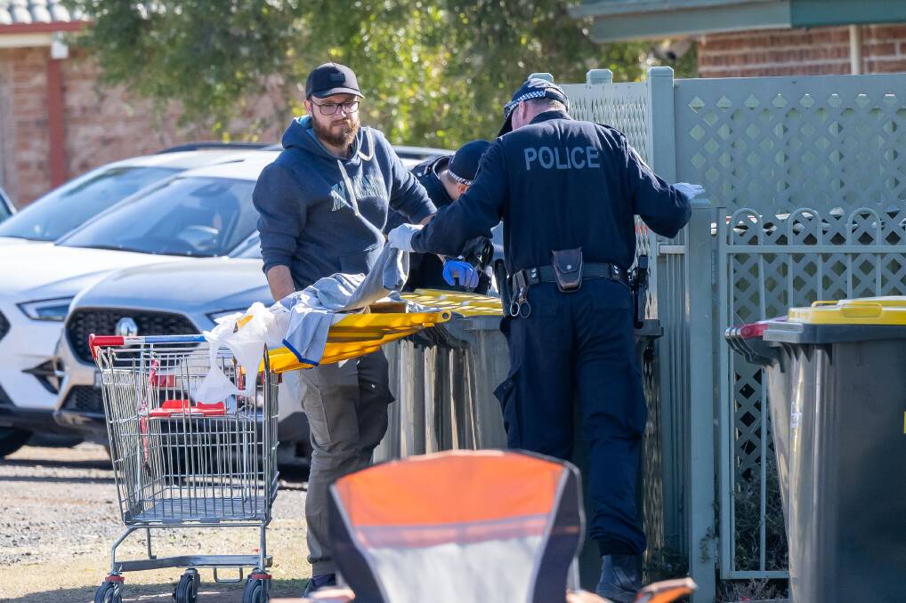 Police comb the crime scene in and around Susanne Street and Woodward Avenue in Tamworth on Monday, June 19. Pictures by Peter Hardin