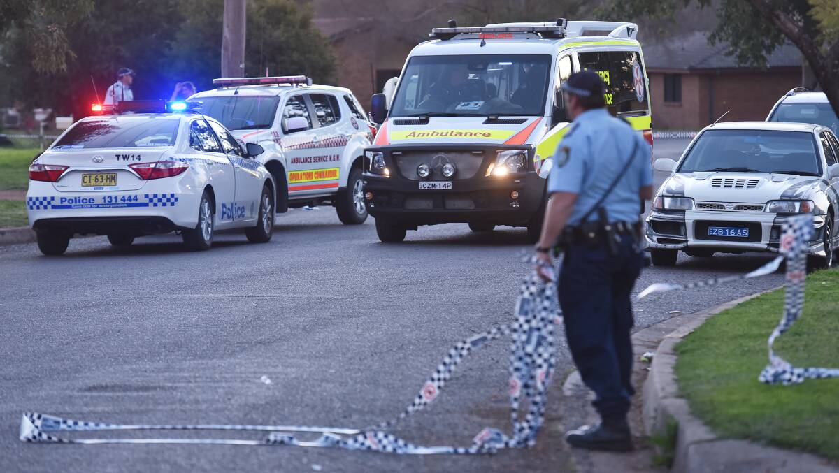 Crime scene: Police and paramedics rush to help the 38-year-old alleged victim who was stabbed 22 times in Coledale. Photo: Gareth Gardner 170816GGC05