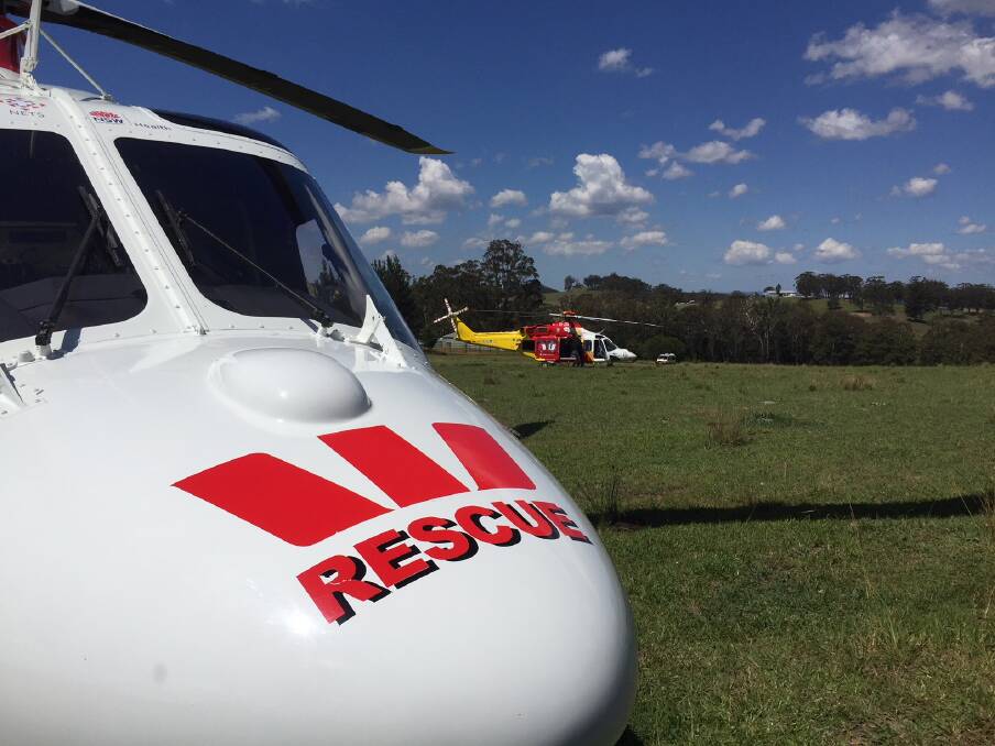 Deadly scene: The Westpac Rescue Helicopters at the scene off the Oxley Highway between Yarrowitch and Walcha on Thursday afternoon. Photo: Westpac Rescue Helicopter Service