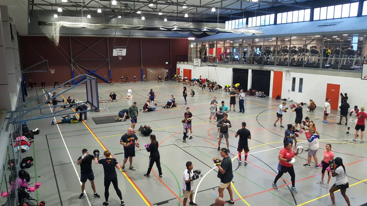 In the ring: Up to 100 kids and mentors attend the boxing sessions three times a week in Redfern in Sydney for the program that engages troubled teens.