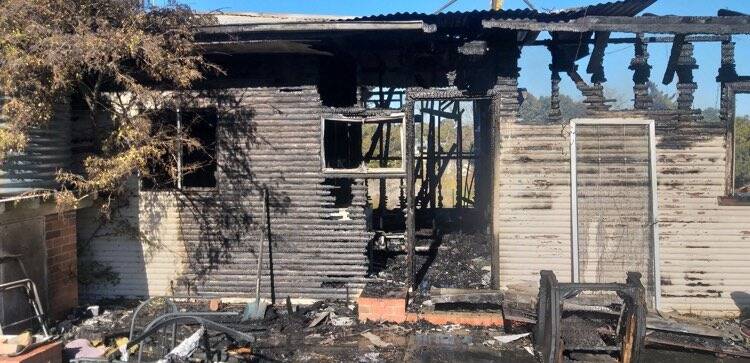 CHARRED REMAINS: The burnt out shell of the Tingha home where a man was found dead on Monday morning. Photo: Supplied