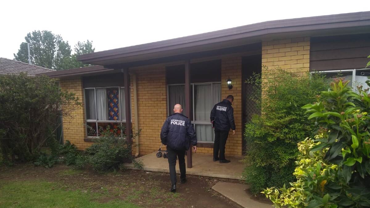 Search warrant: Strike Force Fryer detectives raid the home in Solomon Avenue in Armidale, seizing goods on Friday morning.
