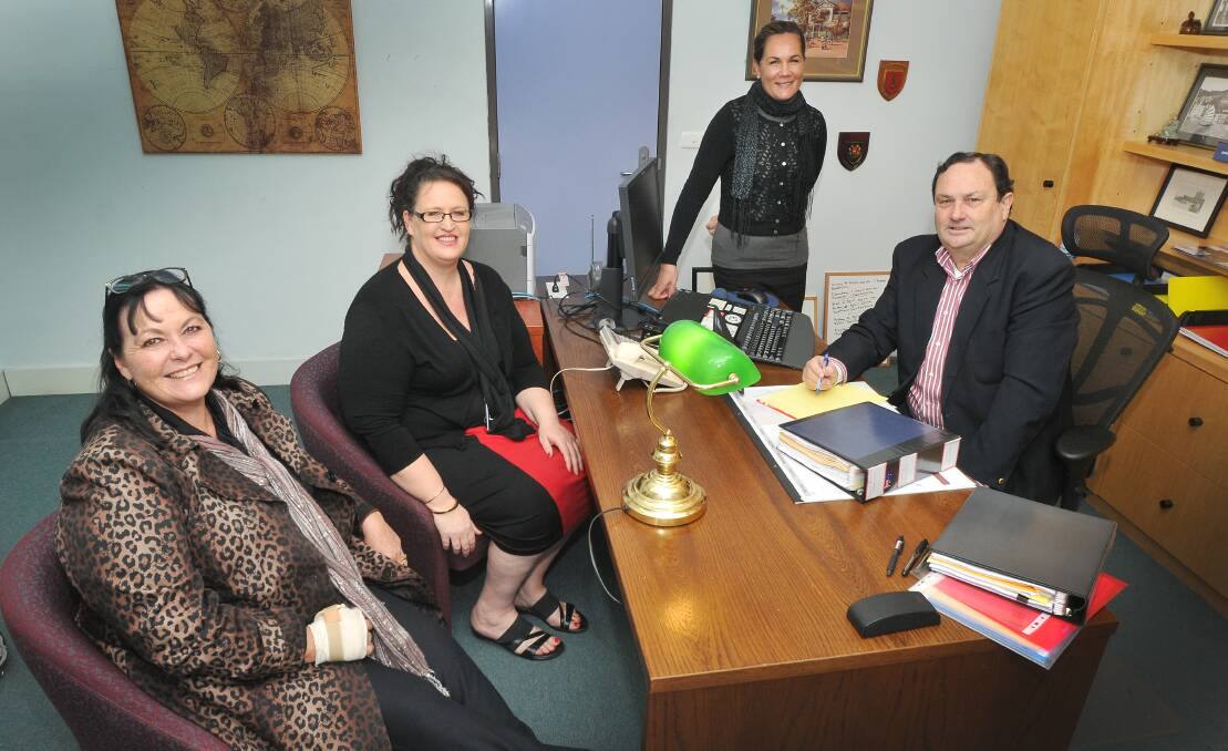 Magistrate credits trial: The Credit program had three case managers including from left to right, Lindy, Bronny and Naomi, with Magistrate Michael Holmes in 2014. Photo: Gareth Gardner 160614GGA07