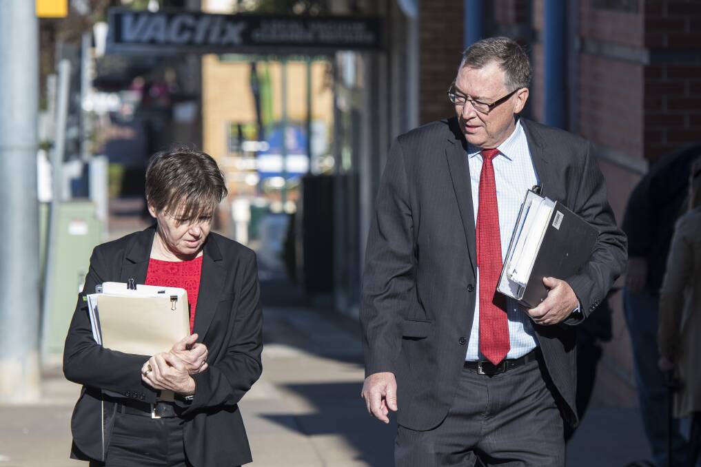 In court: Mark McDonald's solicitor Amanda Gaw, left, with Matthew Hill's solicitor Greg Birtles, right, outside Tamworth Local Court. Photo: Peter Hardin