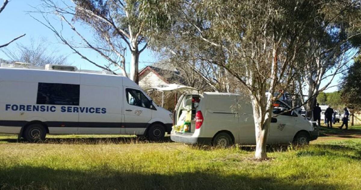 Crime scene: Forensic police and detectives at the Dangars Falls Rd property at Dangarsleigh near Armidale on Thursday morning where a 43-year-old man's body was discovered.