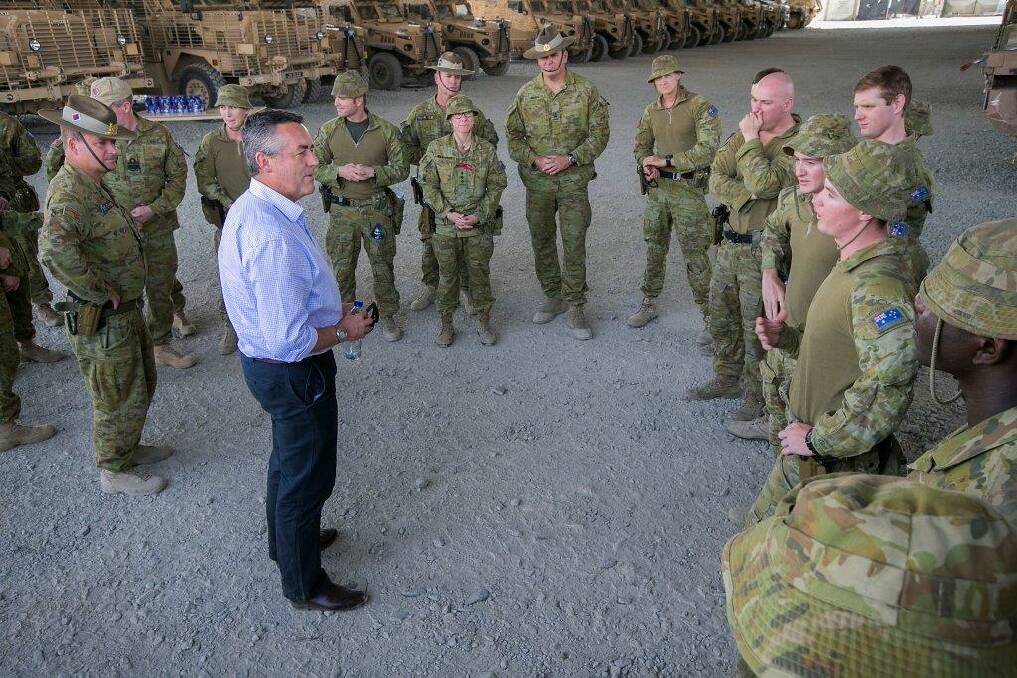 Giving thanks: Minister for Defence Personnel and Veterans’ Affairs Darren Chester visited troops in Iraq and Afghanistan last month. Photo: Supplied