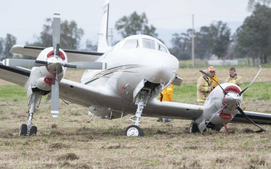 Emergency services at Gunnedah Airport on August 20 after the light plane crashed during take off. Photo: Peter Hardin