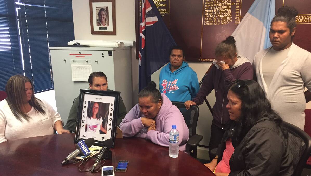 Emotional plea: Johann Morgan's family including her sister Kelly, left, daughter Tamika, sisters, Vivienne and Rhonda pictured front, and sisters Yvonne and Stephanie and nephew Zach, back, after Monday morning's guilty verdict. Photo: Breanna Chillingworth