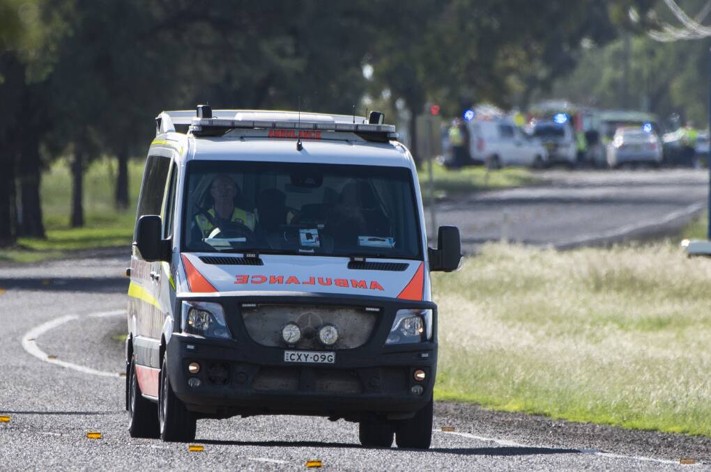 Crash scene: An ambulance leaves the scene. Photo: Peter Hardin