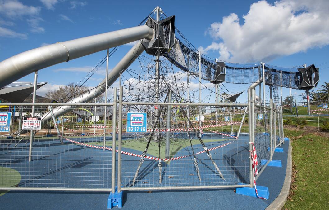 Out of action: Part of the playground where the cables were cut still remains fenced off from the public, more than a month after the alleged acts. Photo: Peter Hardin