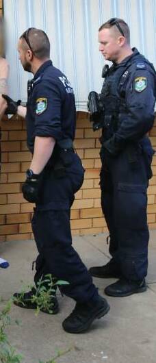 Sentence delayed: Police at the arrest of one of the targets in Tamworth in May 2019. Photo: NSW Police