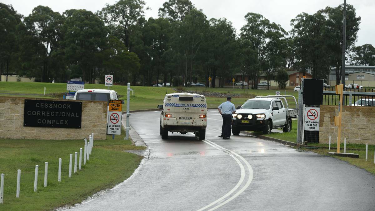 Charges in court: Police outside Cessnock Correctional Centre on the day of the riot in April.Twenty one men have been charged with rioting, participating in a criminal group and damaging property. Picture: Jonathan Carroll