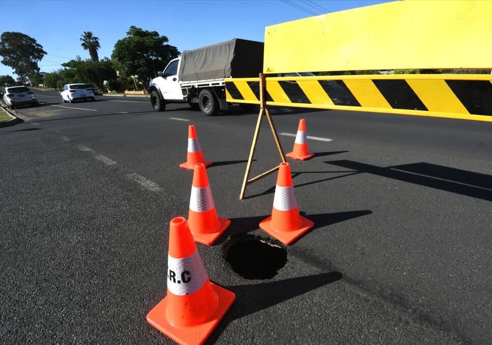 Road shut: The sinkhole that has opened up in South Tamworth on Wednesday. Photo: Gareth Gardner