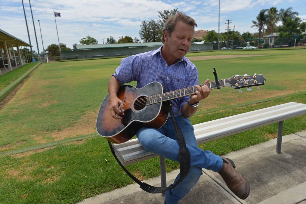 Butterflies: Troy Cassar-Daley takes a moment on Wednesday at the North Tamworth Bowling Club. Photo: Ben Jaffrey