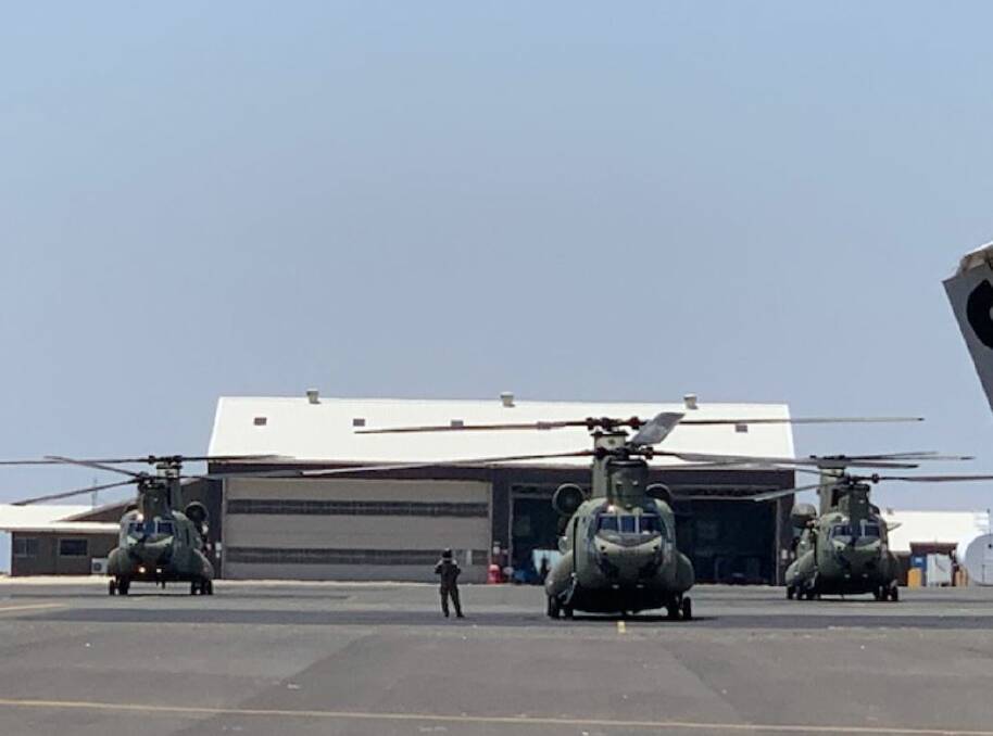 Stopover: The three chinooks at the Tamworth Airport on Thursday. Photo: Tamworth Airport