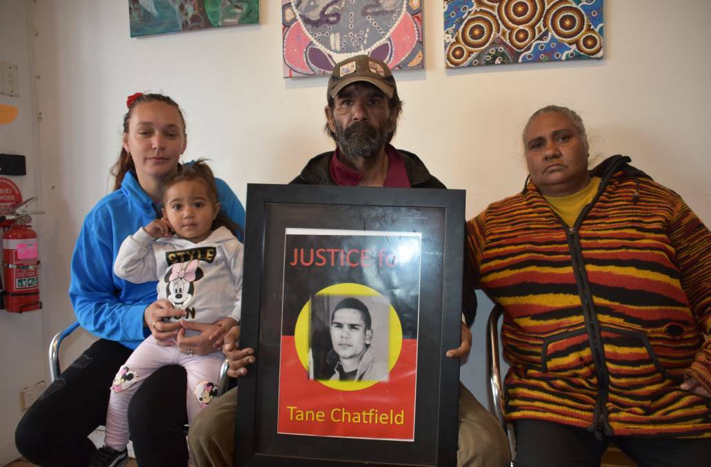 FAMILY: Tane Chatfield's partner Merinda Murphy, and his parents Colin and Nioka. The prison system inadequately cared for Tane Chatfield before he killed himself, a coroner says.
