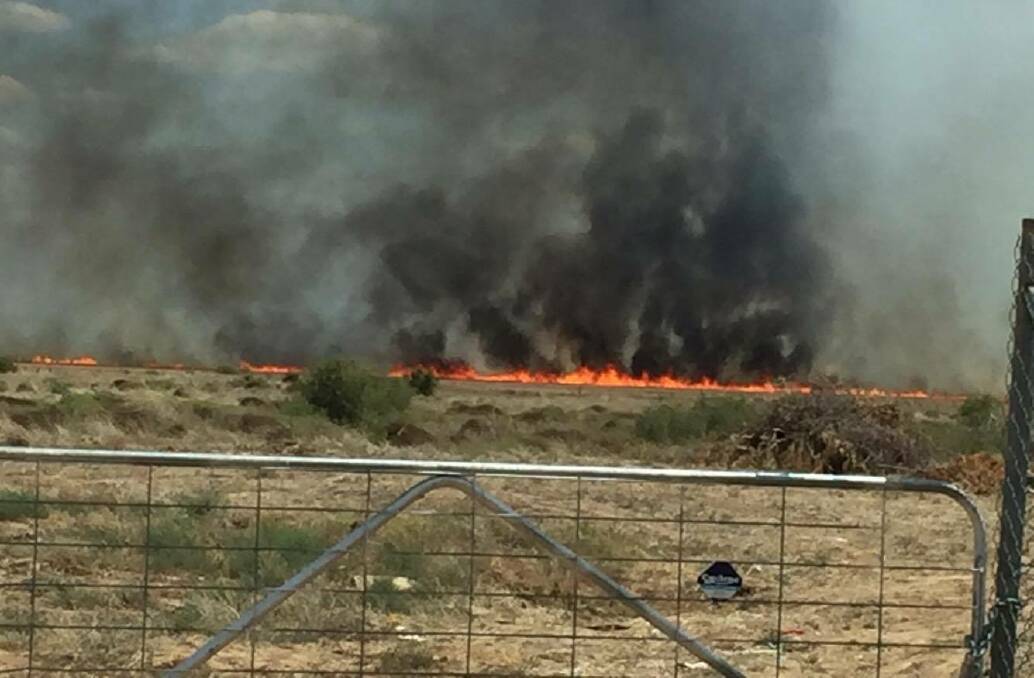 Out of control: One person has suffered burns in the Binnalong Rd fire. Photo: Kristian Hancock