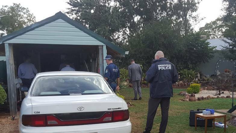 Search warrant: Oxley police and Strike Force Munderah detectives at the Baker Street raid in Gunnedah in late-February 2019. Photo: Oxley Police District