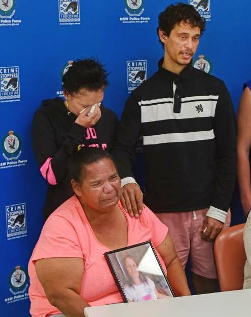 DESPERATE PLEA: Johann Morgan's children, Tamika and Michael Morgan, pictured back, comfort Vivienne Morgan as they plead for help to find their mother in 2015. Photo: Gareth Gardner 240815GGC02