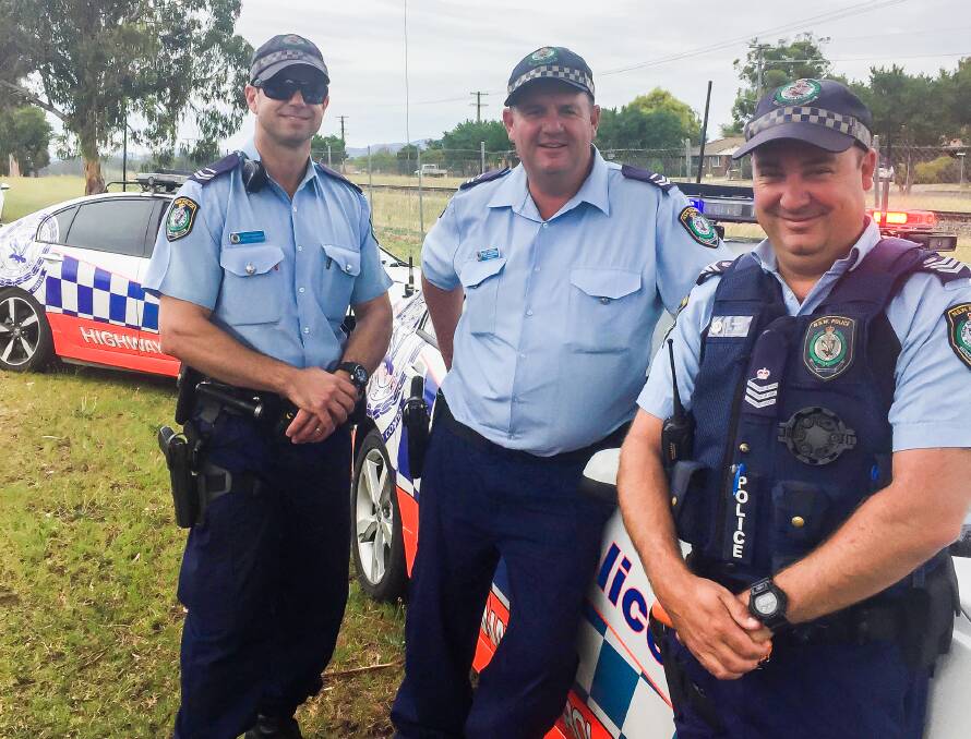 On duty: Senior Constables Brock Freeman and Dean Robertson, with Sergeant Michael Buko carry out random breath testing in Tamworth on Friday.
