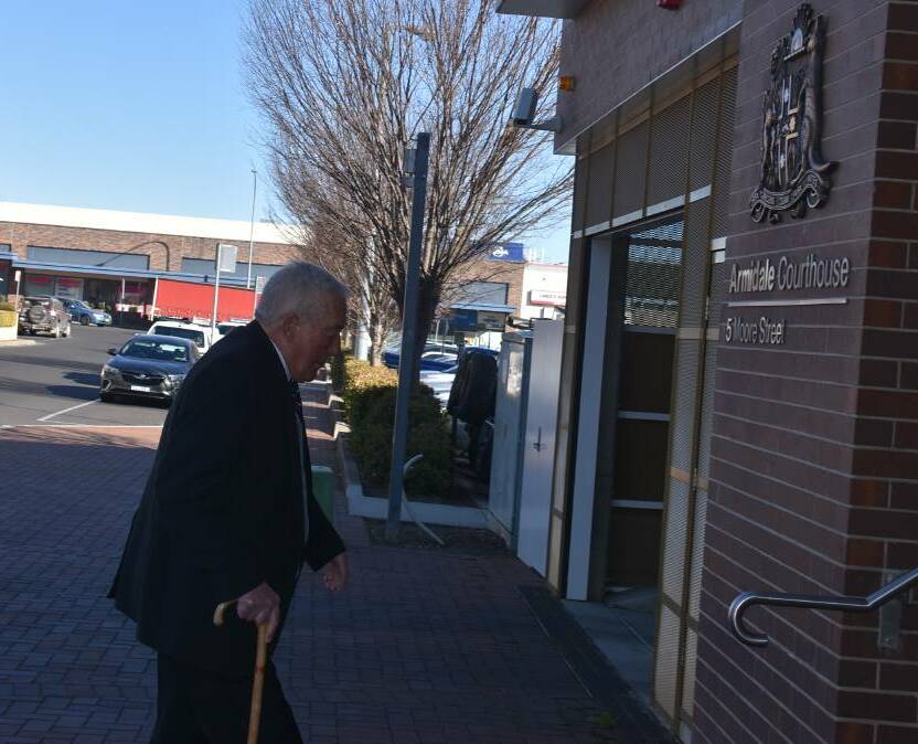 Standing trial: Former Catholic priest David Joseph Perrett outside Armidale Local Court in 2018. He remains bail refused after being committed for trial. Photo: Nicholas Fuller