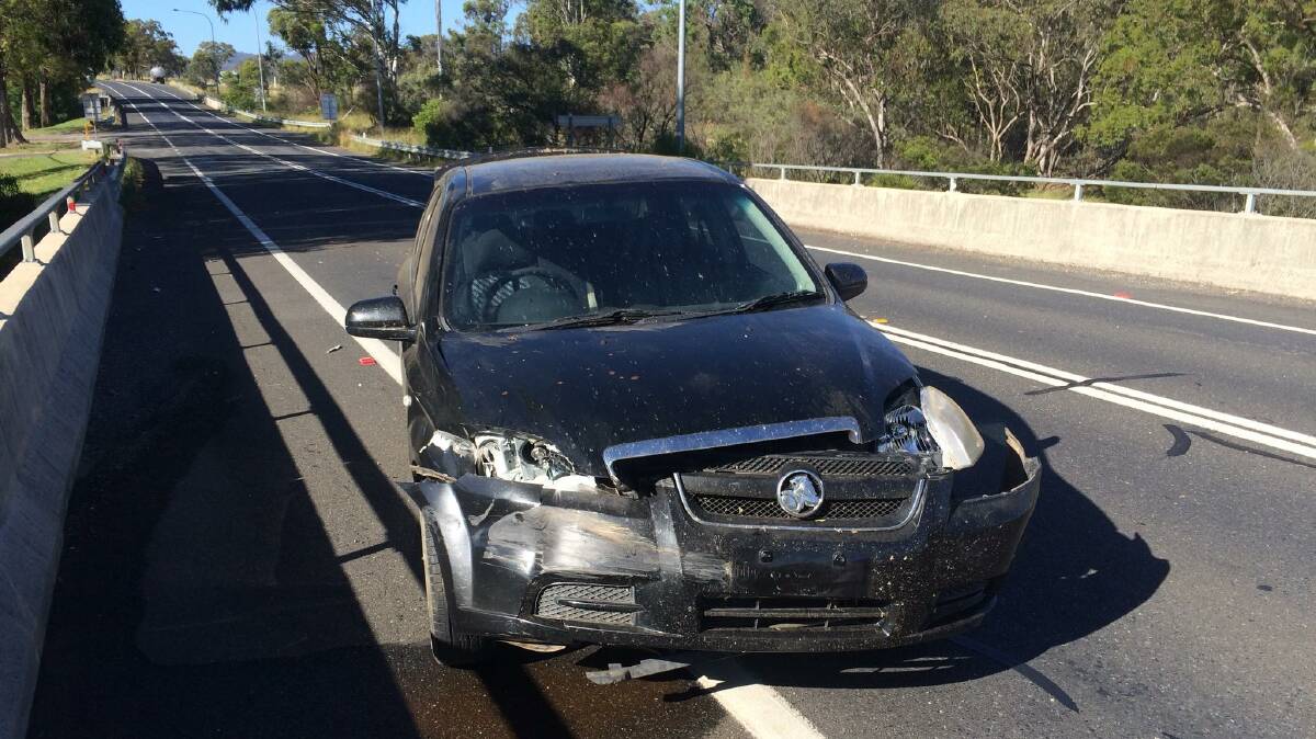 Raft of charges: The Holden Barina after it crashed on the New England Highway at Tenterfield on New Year's Eve. Photo: NSW Police