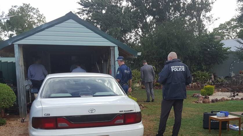 Charges in court: Strike Force Munderah police execute a search warrant at a Baker Street, Gunnedah, home on February 28. Photo: Oxley Police