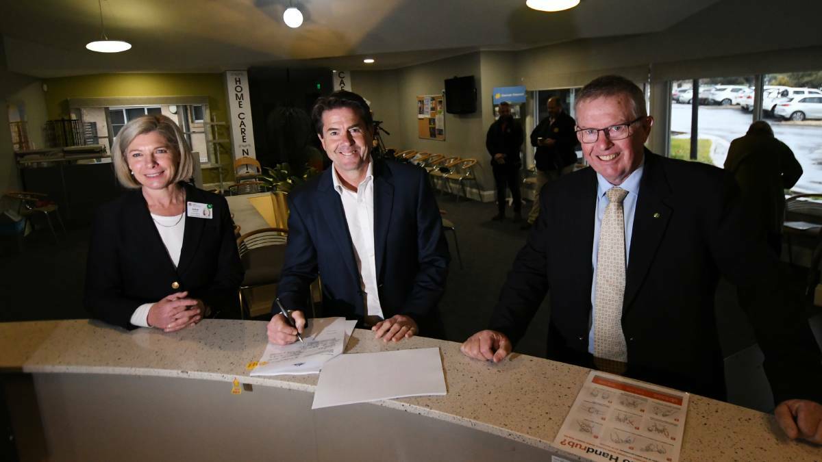 Letters: Hunter New England Health's Susan Heyman and Parkes MP Mark Coulton sign the deed for the Gunnedah Rural Health Centre.as Tamworth MP Kevin Anderson witnesses the signature on Friday. Photo: Gareth Gardner