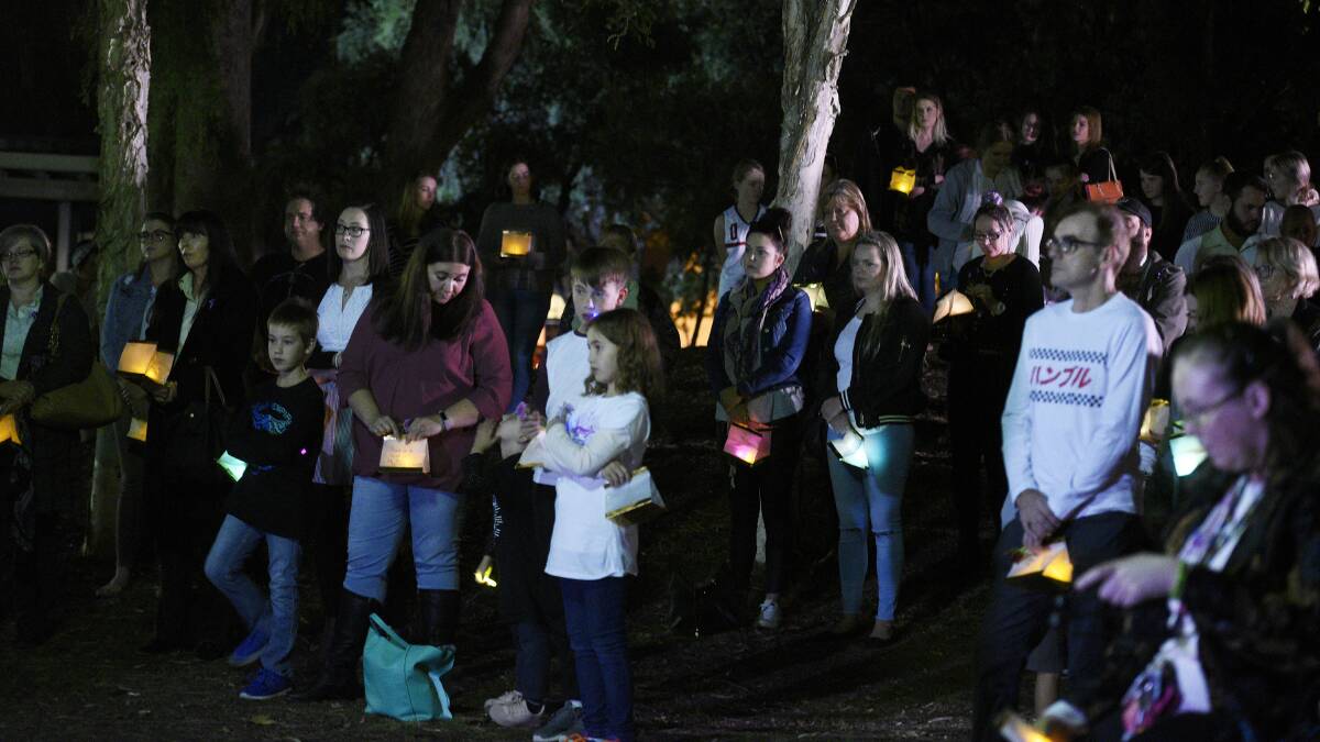 Standing together: Dozens of people stood side-by-side for the candlelight vigil in Bicentennial Park in Tamworth on Wednesday night. Photo: Gareth Gardner