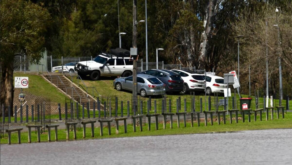 Cars were moved to higher ground at Gipps Street in Tamworth after floodwater inundated the carpark. Picture by Gareth Gardner