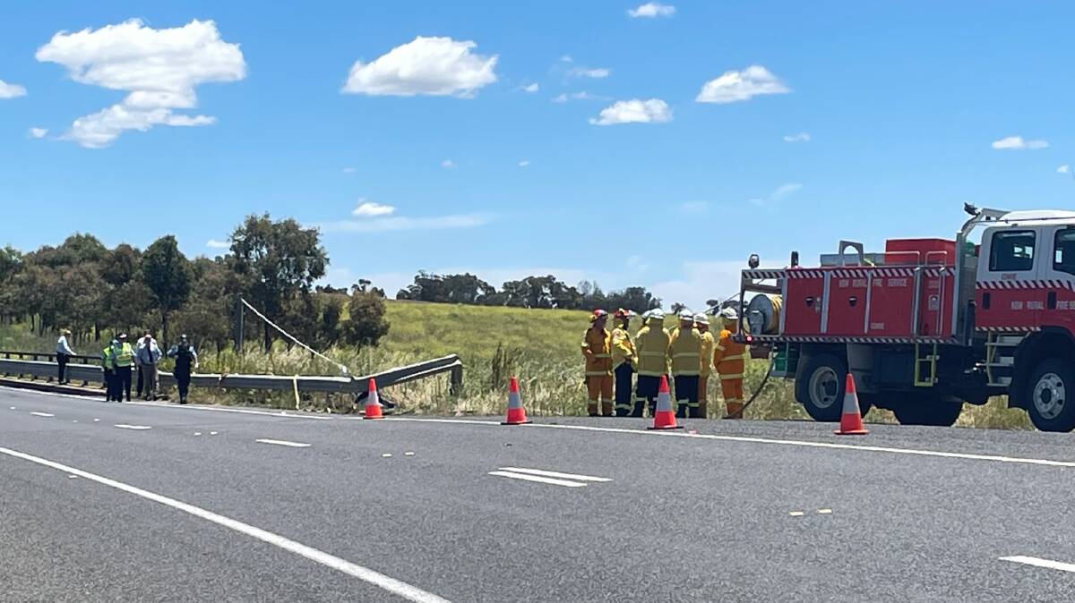 Police and fire crews at the scene on the New England Highway near Tamworth. Picture by Peter Hardin